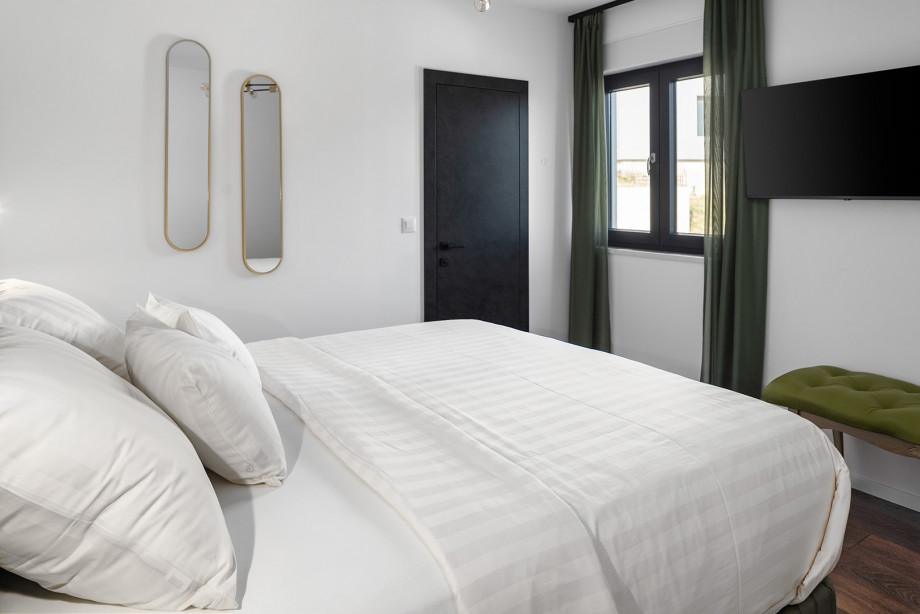 En-suite with shower, a TV, views of the natural surroundings