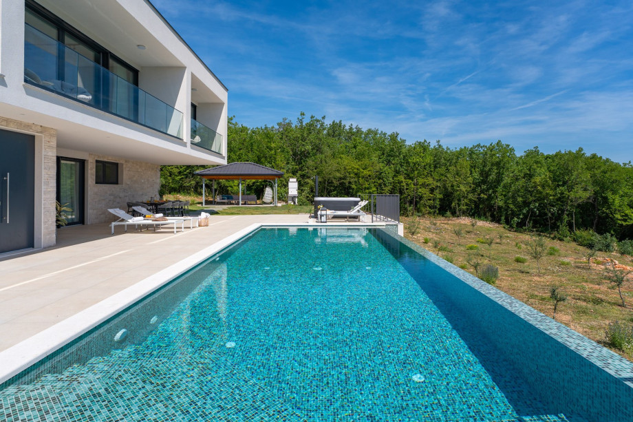 Step outside and indulge in the private oasis of the heated infinity pool,