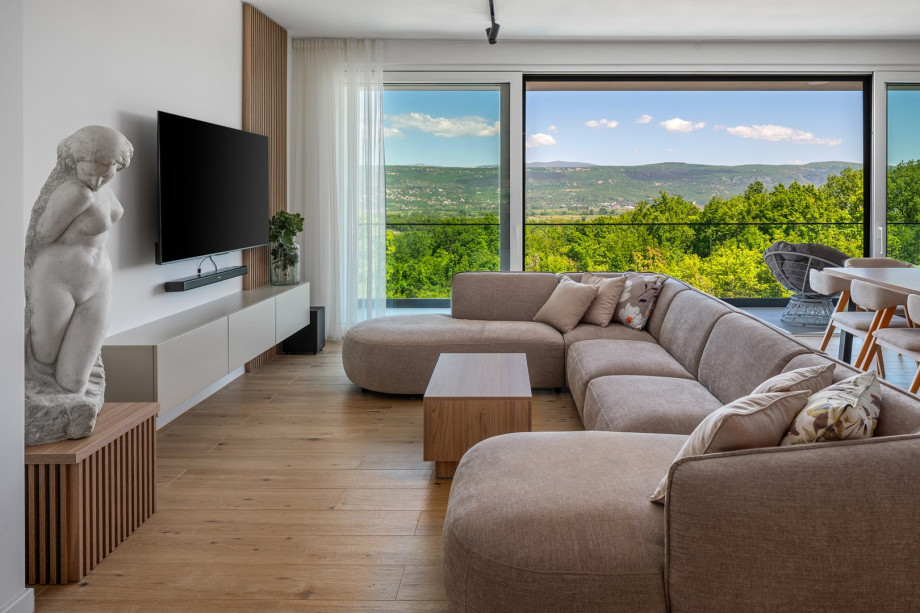 A spacious living room with a comfortable sofa