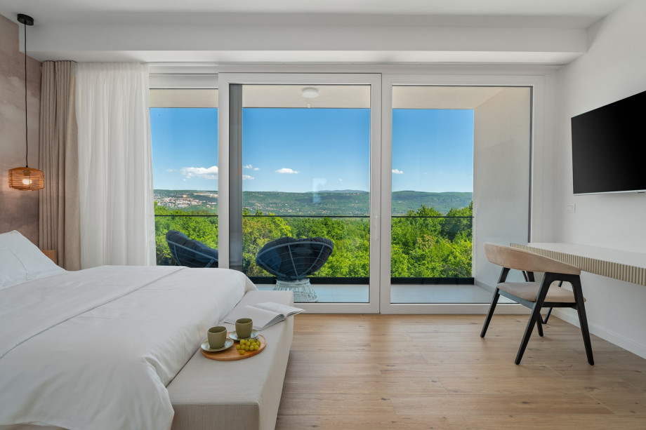 Bedroom No1 also offers an A/C, a TV, and a balcony with pool views