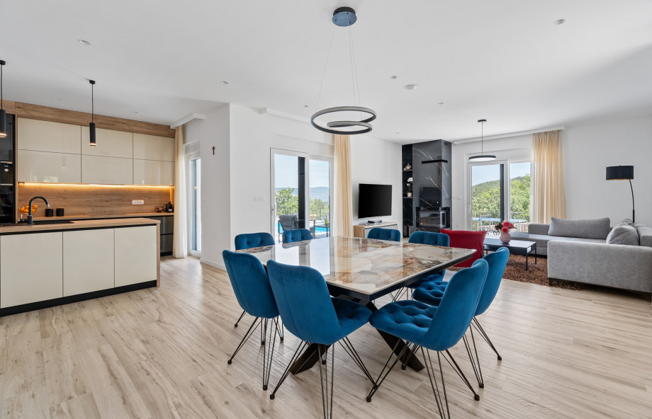 Comfortable dining area with an exit to the pool area