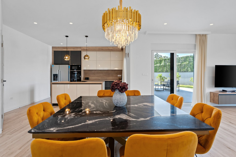 Open-plan living and dining areas provide ample space for socializing, relaxing, dining together