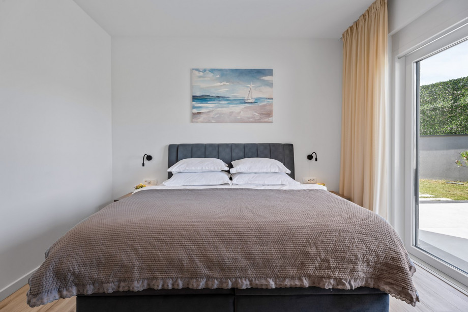 Bedroom No 1 has an exit to the terrace next to the pool ,TV