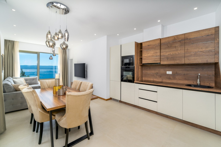 The ground floor level where you have a second dining area, a fully equipped kitchen, and a separate family bathroom with a shower