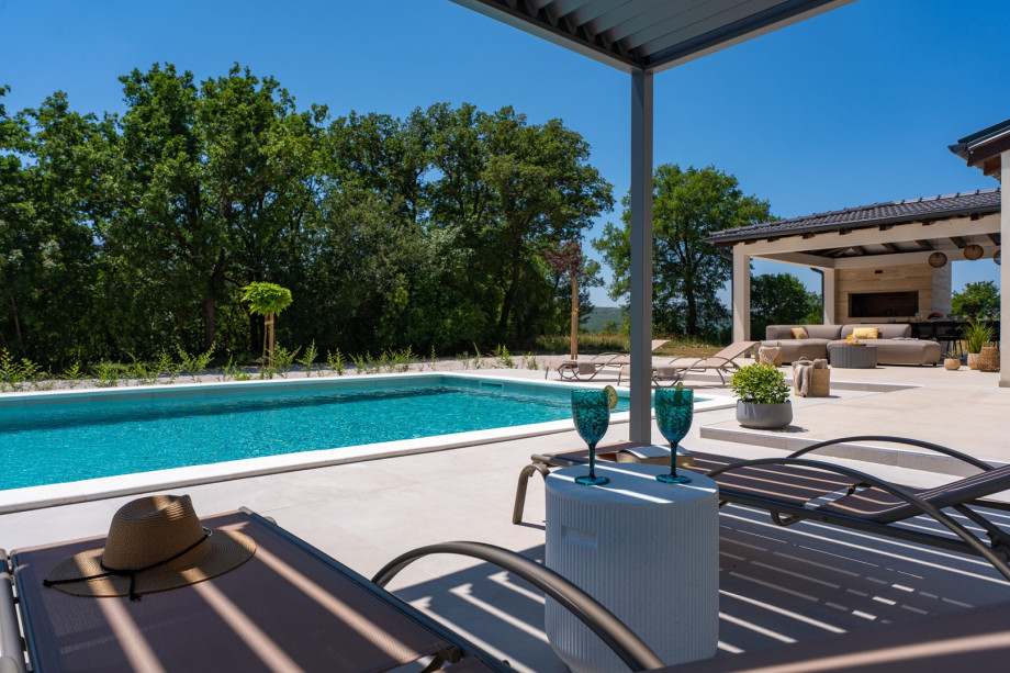 Spacious sun deck with loungers, ideal for enjoying