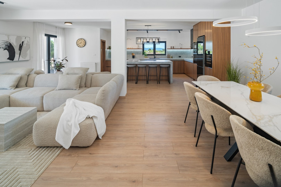 Open-plan living and dining area fully air-conditioned with direct access to the outdoor dining and pool area