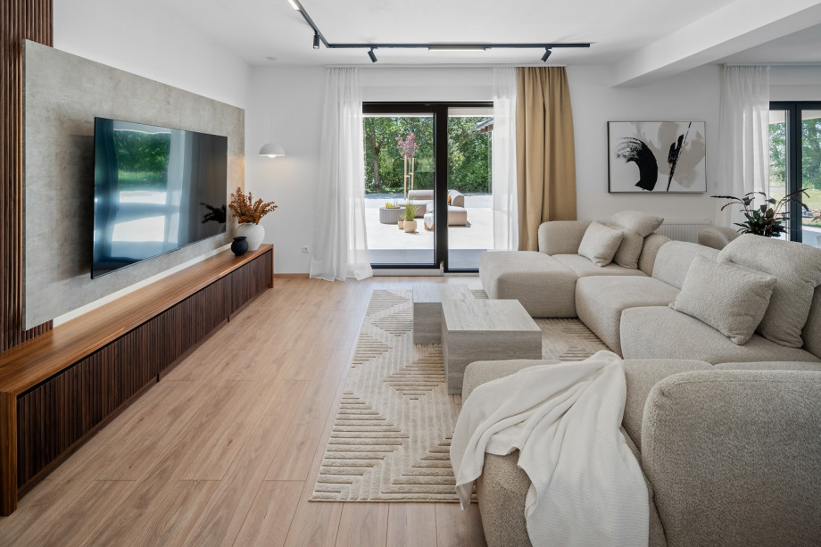 Comfortable sofa with flat-screen TV and PlayStation 5 Slim