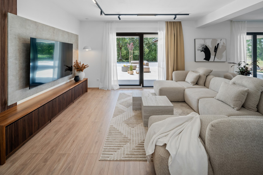 Comfortable sofa with flat-screen TV and PlayStation 5 Slim