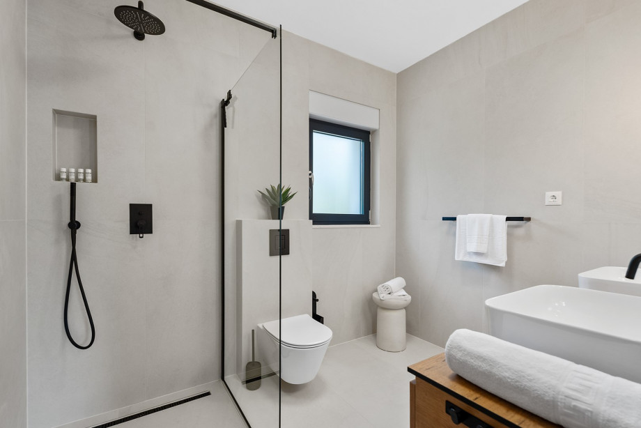 Family bathroom with shower and dual sinks