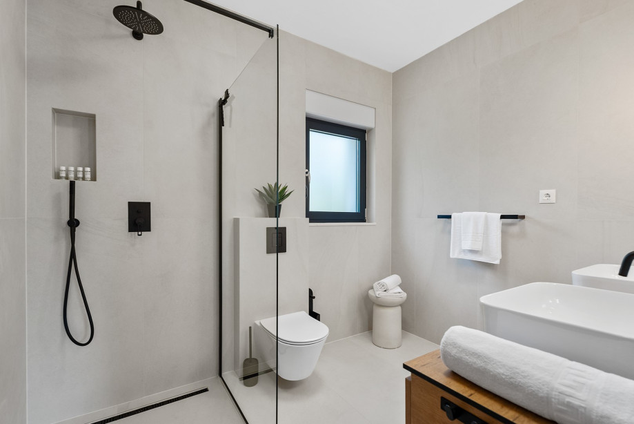 Family bathroom with shower and dual sinks