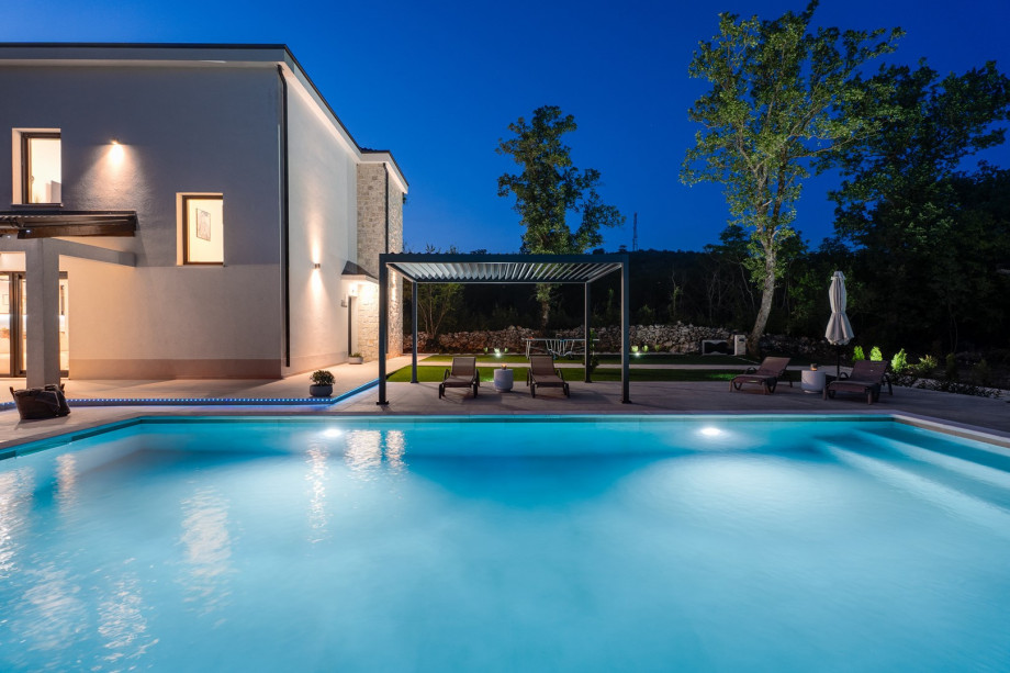 Step outside to discover your very own private retreat: a heated swimming pool