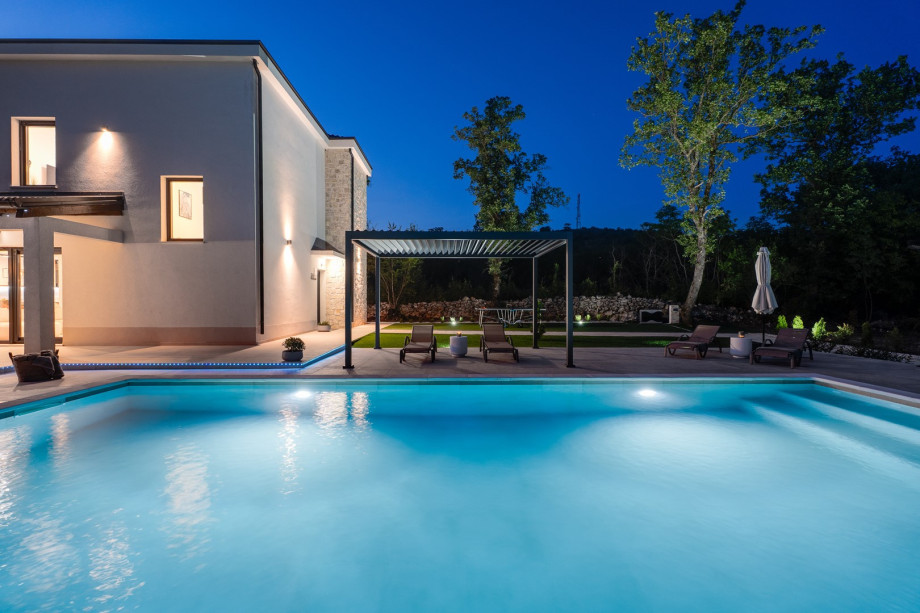 Step outside to discover your very own private retreat: a heated swimming pool