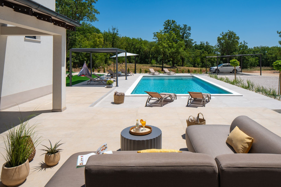 The outdoor space is thoughtfully created for leisure, fun, and memorable family moments