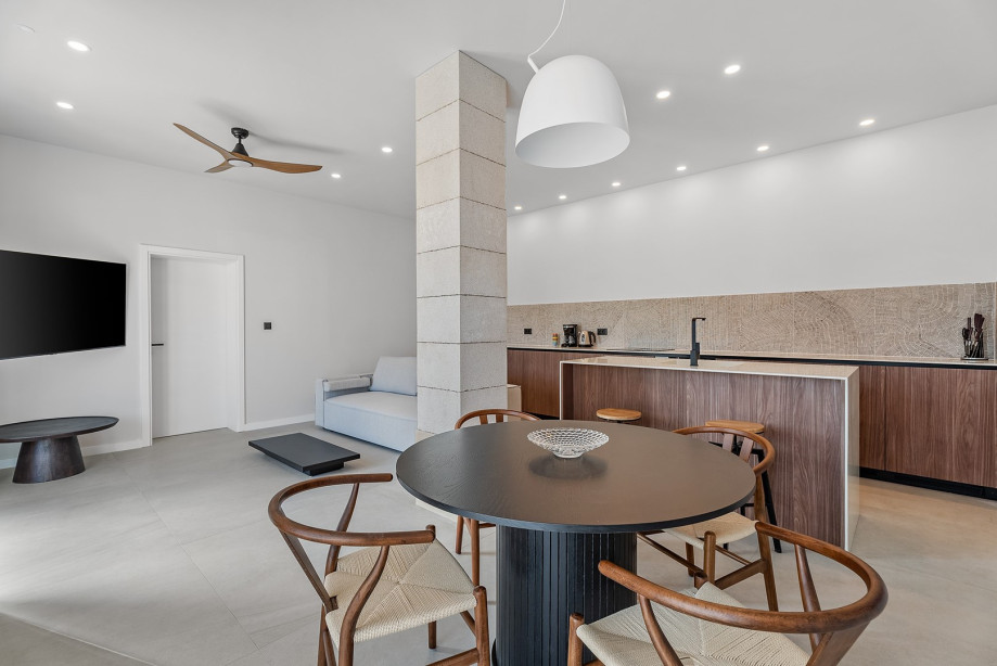 A living room offers an internet-enabled TV with streaming services (such as Netflix) and air-conditioning