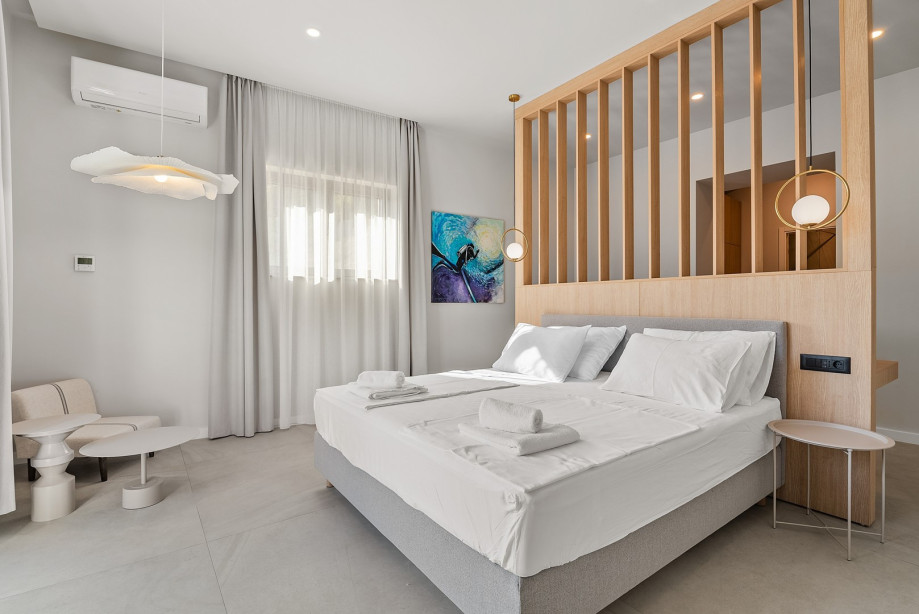 Bedroom NO1 (36sqm) with king-size bed, walk-in wardrobe, and en-suite bathroom with a shower (11sqm)