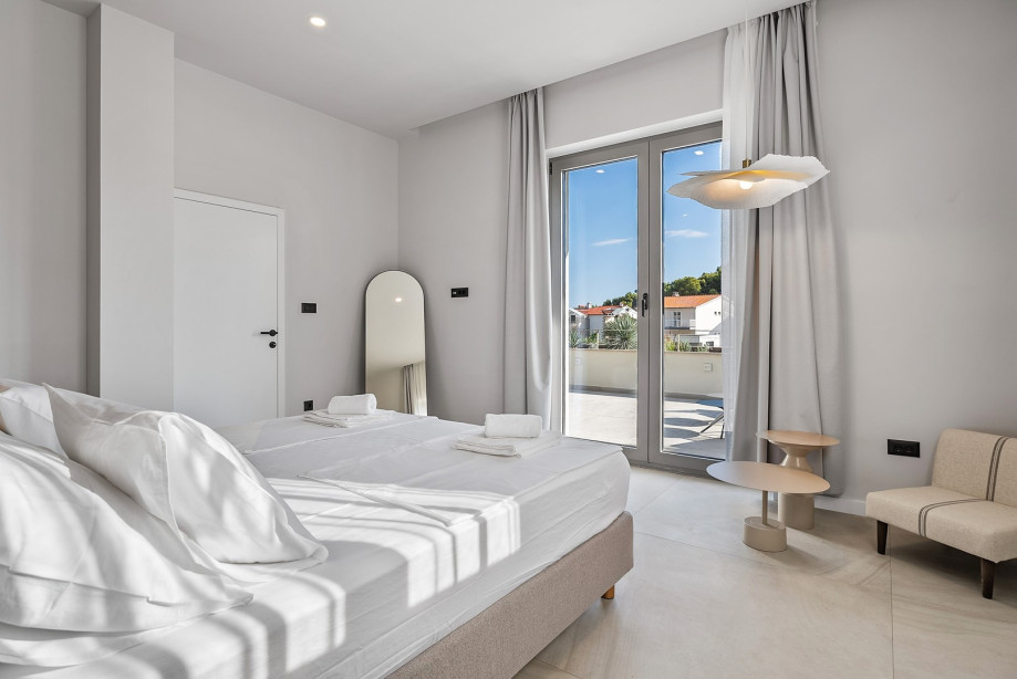 Bedroom NO1 (36sqm) with king-size bed, walk-in wardrobe, and en-suite bathroom with a shower (11sqm)