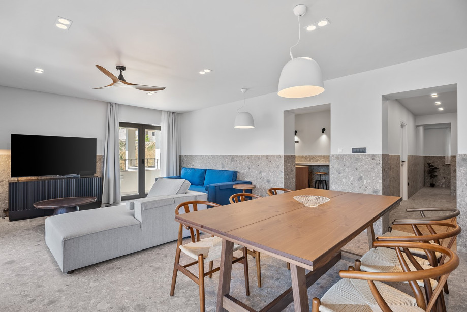 A living room offers an internet-enabled TV with streaming services (such as Netflix) and air-conditioning