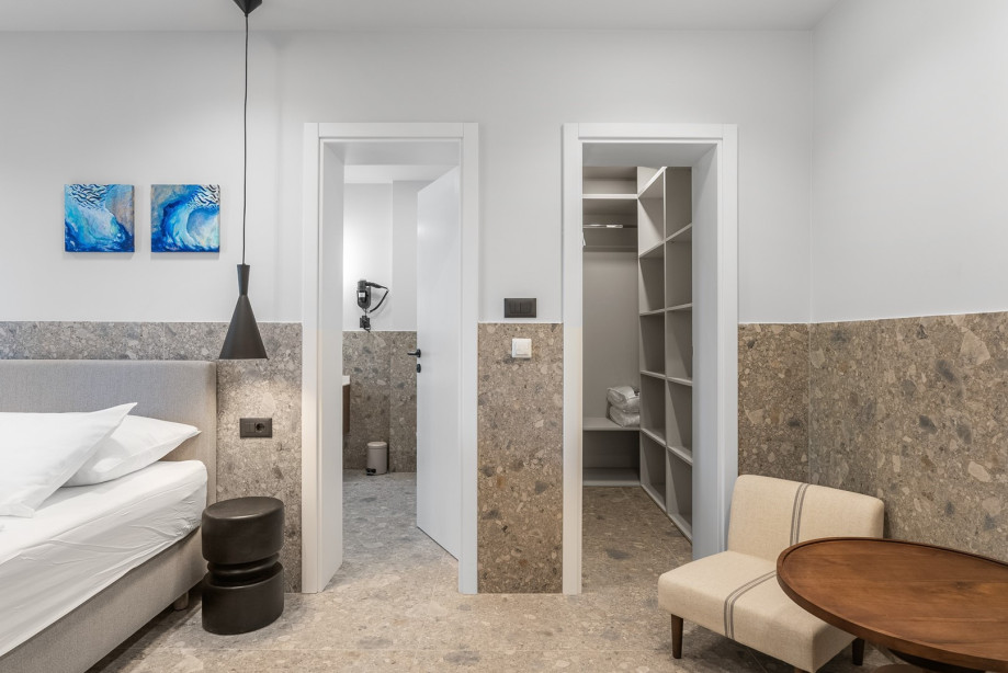 Bedroom NO6 is also equipped with air-conditioning and a walk-in wardrobe