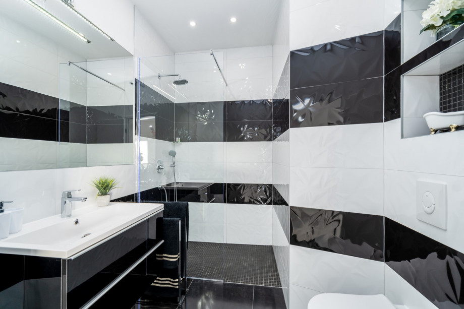 A family bathroom (ground floor) with a shower and a washing machine