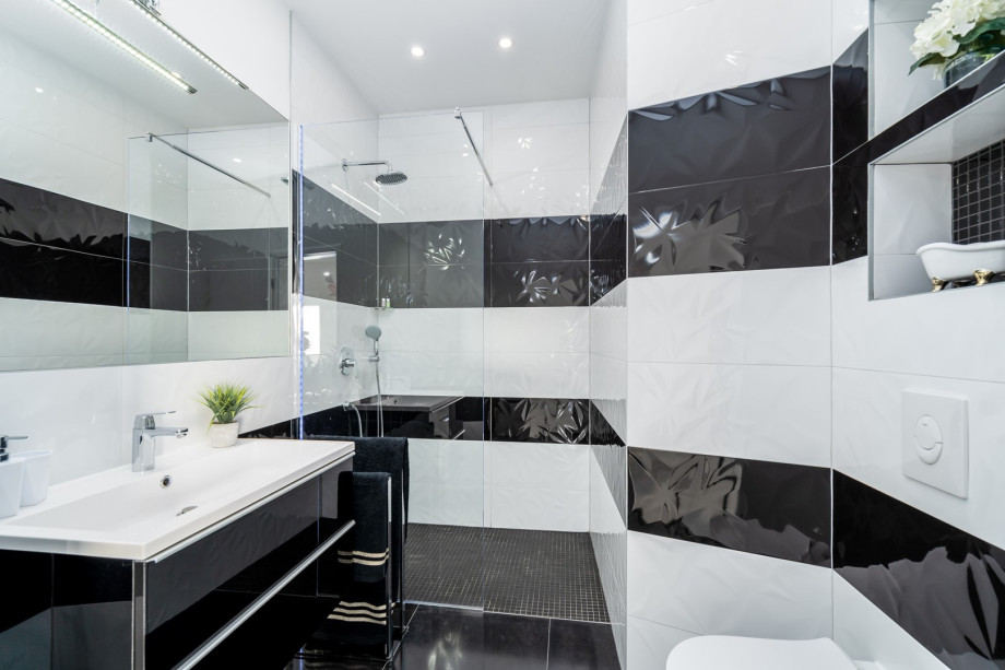 A family bathroom (ground floor) with a shower and a washing machine
