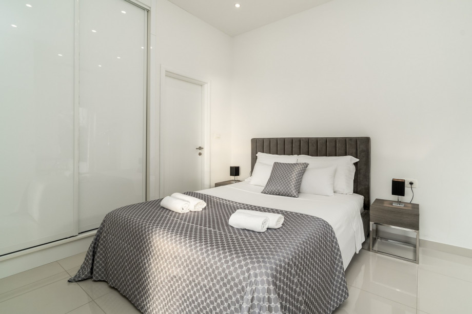 Bedroom No2 offers an en-suite bathroom with a shower, a TV, and A/C