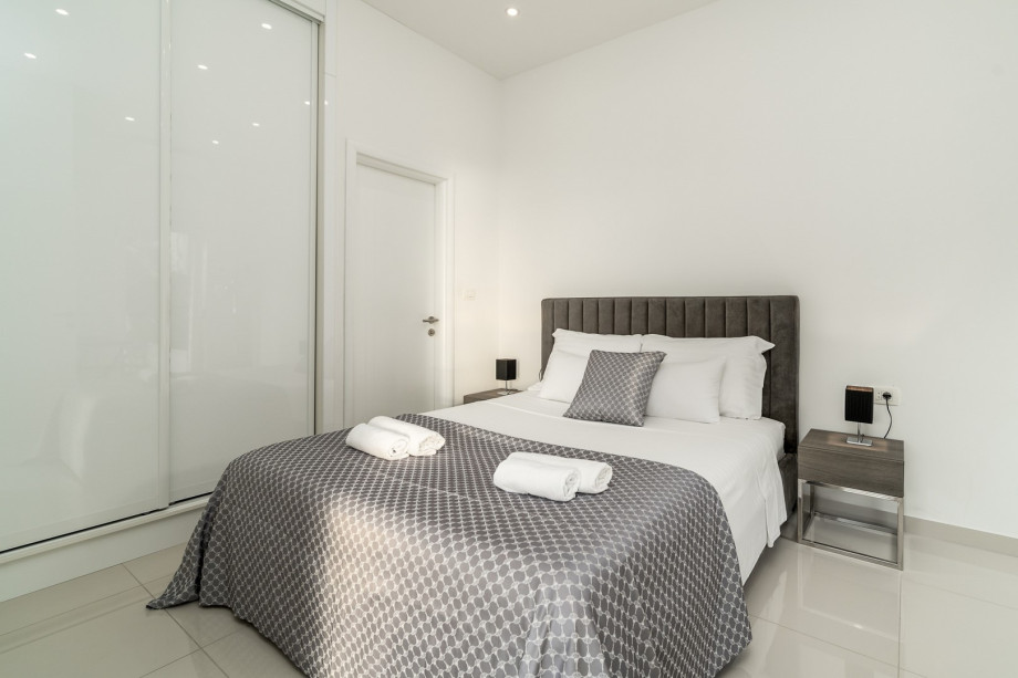 Bedroom No2 offers an en-suite bathroom with a shower, a TV, and A/C