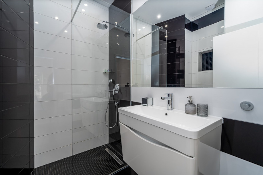 An en-suite bathroom with a shower, a toilet and a sink