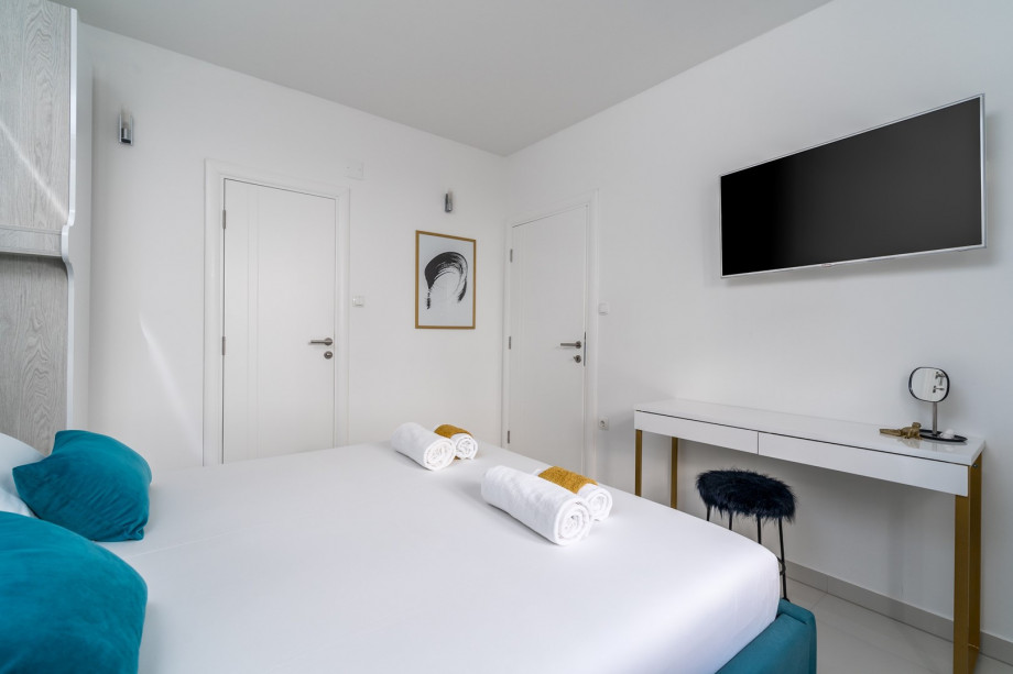 Bedroom No3 offers an en-suite bathroom with a shower, a TV, and A/C