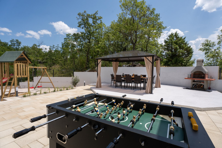 Outdoor games including table tennis and table football