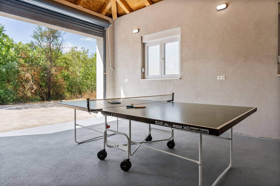 Outdoor games including table tennis and table football