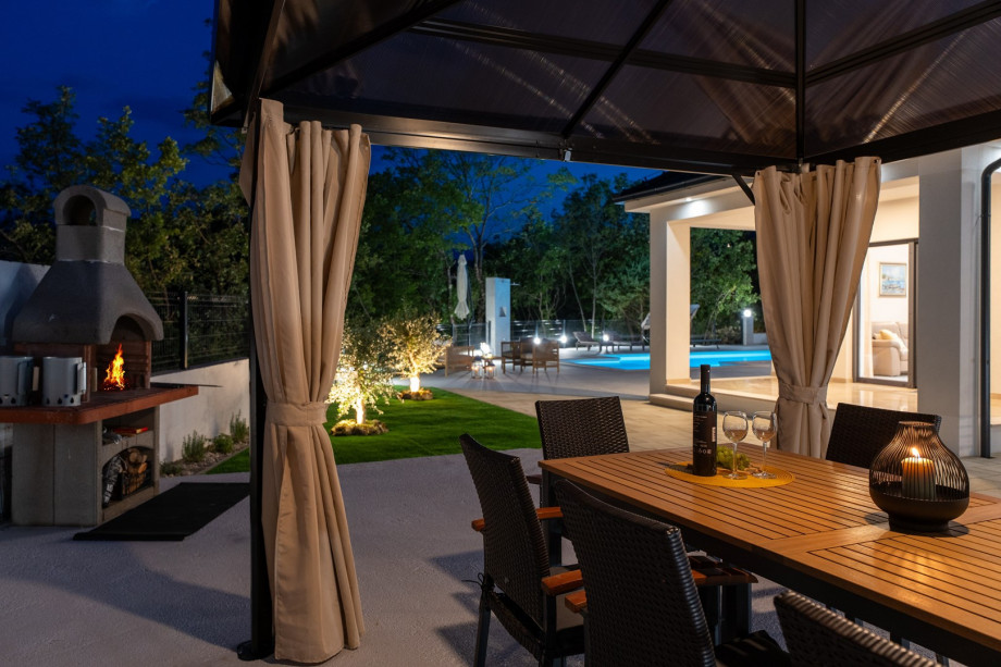 The tranquil surroundings effortlessly blend indoor and outdoor living, allowing for seamless gatherings and unforgettable moments with loved ones.