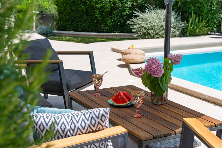 Lounge furniture next to the pool