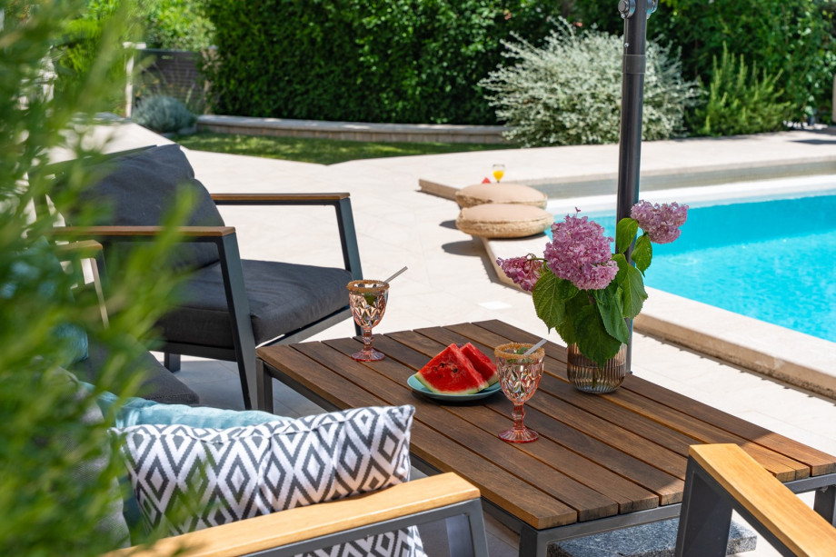 Lounge furniture next to the pool