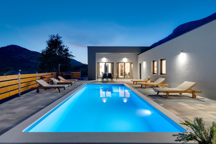 Private swimming pool with 6 deck chairs, outdoor dinning area with BBQ