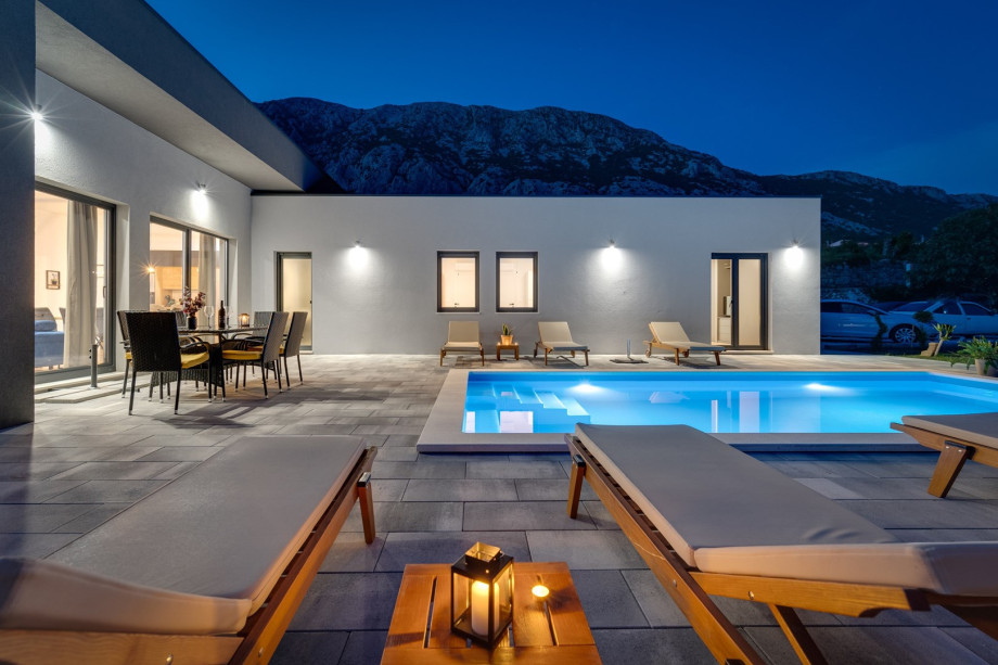 Private swimming pool with 6 deck chairs, outdoor dinning area with BBQ