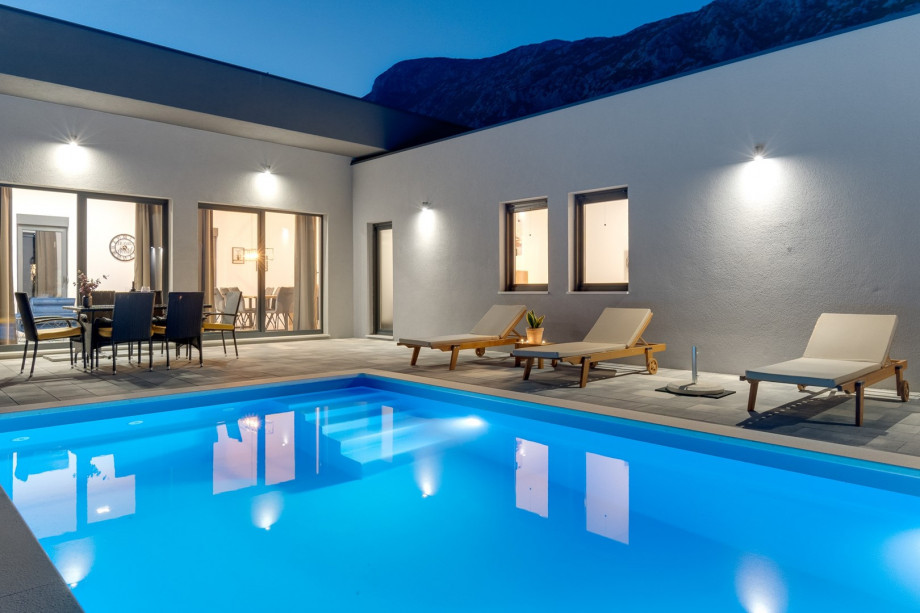 Private swimming pool with 6 deck chairs, outdoor dinning area with BBQ