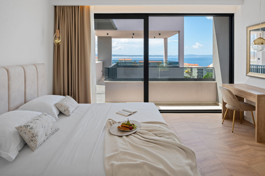 En-suite bedrooms, each with air conditioning, a TV, and stunning sea views