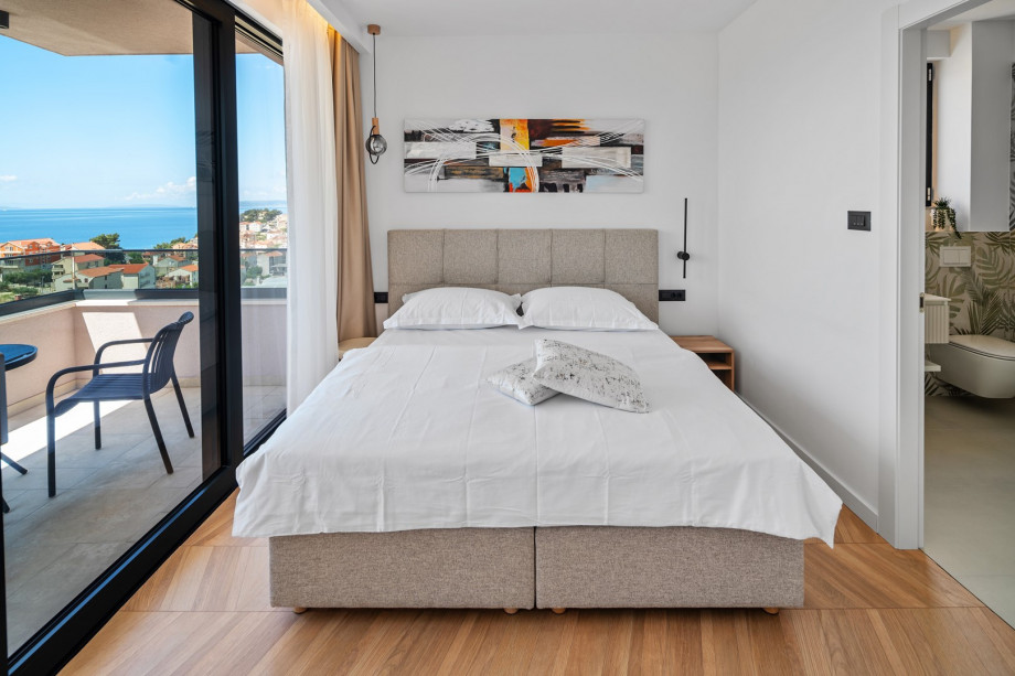 All bedrooms include air conditioning, towels, and premium linens.