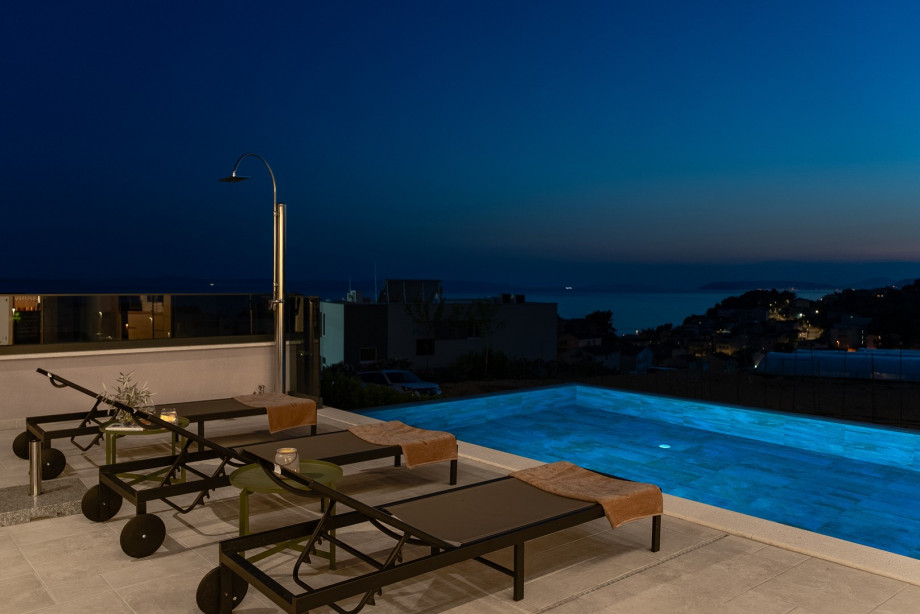 Enjoy the peaceful night outdoors, relaxing on the seating