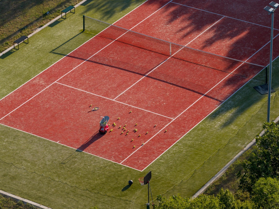The outdoor area also offers a Tennis court with an artificial grass