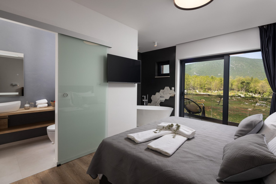 Bedroom No1 also offers a TV, an A/C, and a balcony