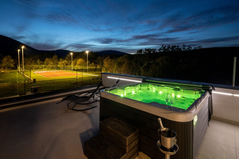 On the first floor is a terrace with the Hot Tub, 2 deck chairs, and a swing (accessed from each bedroom)