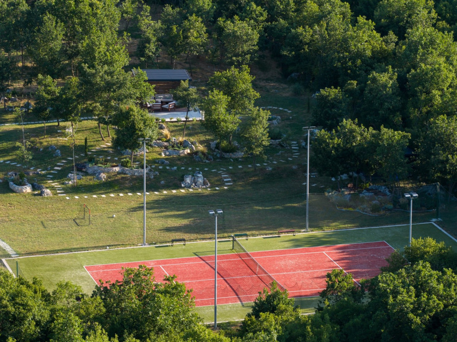 The outdoor area also offers a Tennis court with an artificial grass