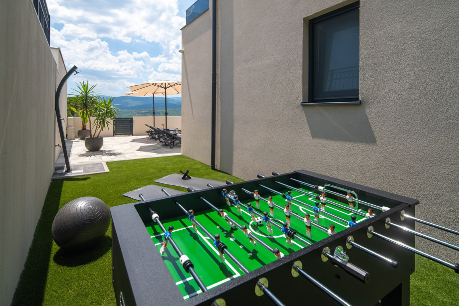 Outdoor play and entertainment area, enriched with several exercise equipment