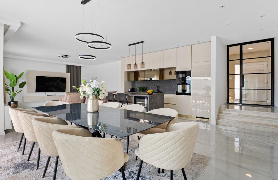 The ground floor unveils a sprawling 65 sqm living and dining area designed for relaxation and social gatherings