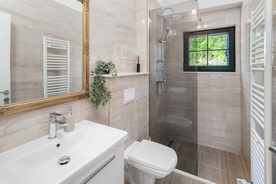 There is a family bathroom located on the first floor with a shower, a toilet and a sink