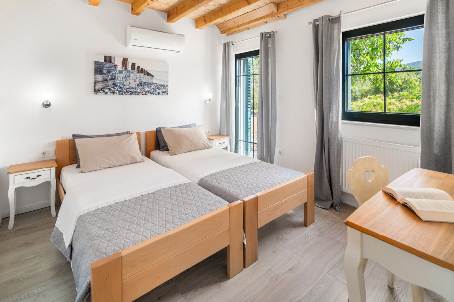 Bedroom No2 with two single beds 90cm x 200cm (can connect into double) and a balcony