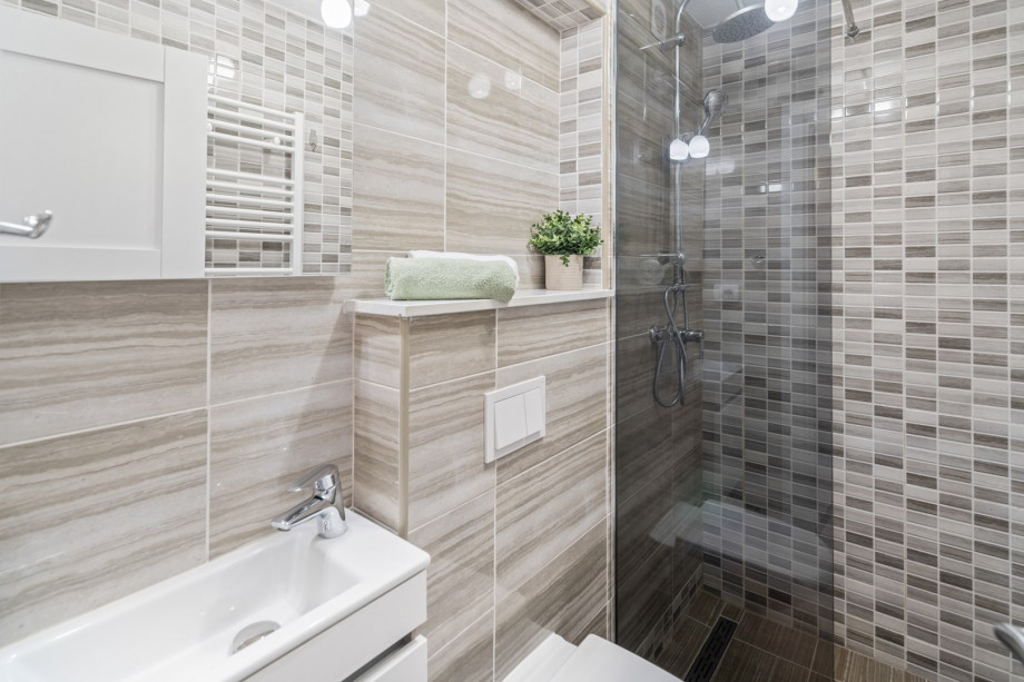 There is a family bathroom located on the first floor with a shower, a toilet and a sink