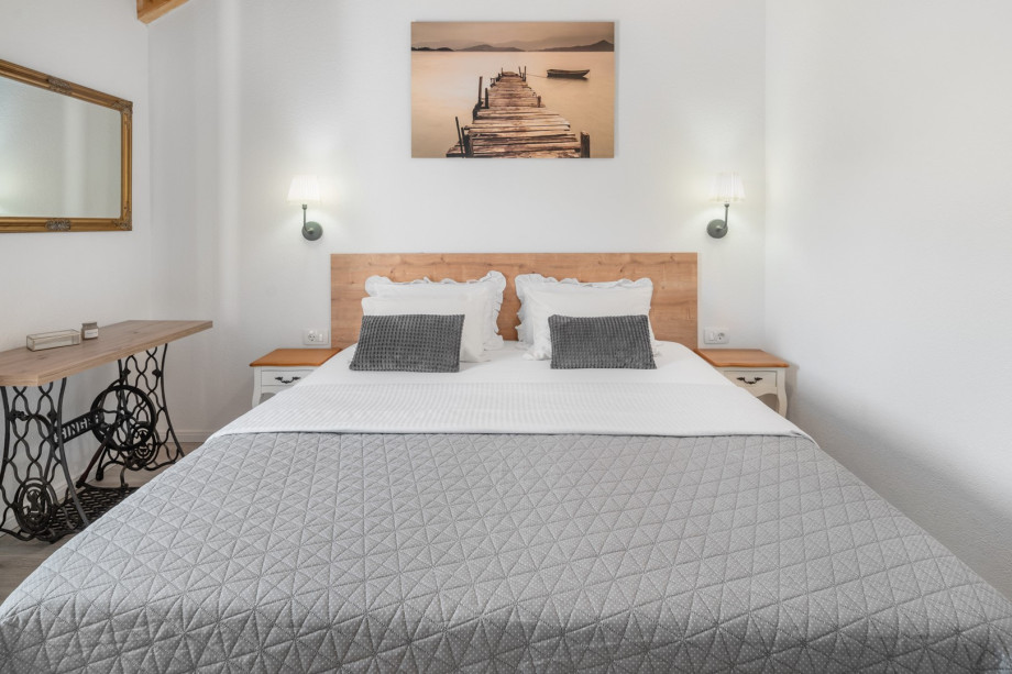 Bedroom No4 with queen size bed 160cm x 200cm and a balcony with outdoor stairs to the ground floor level.