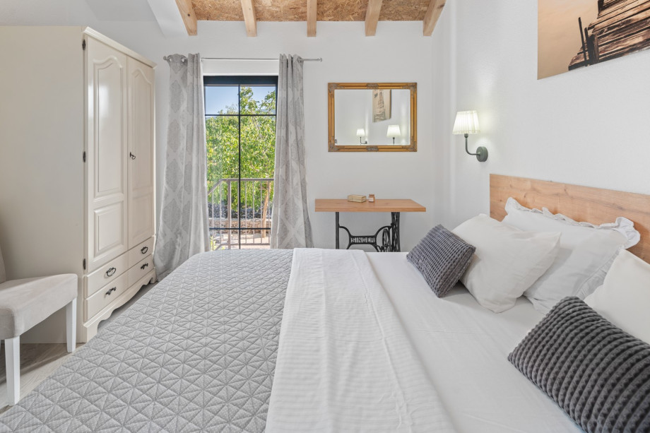 Bedroom No4 with queen size bed 160cm x 200cm and a balcony with outdoor stairs to the ground floor level.